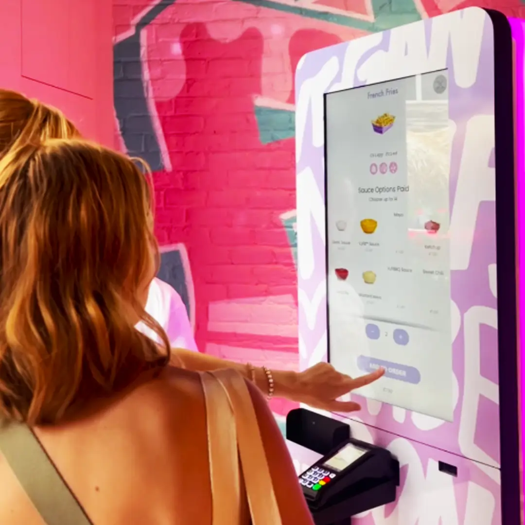 self-order kiosks at a QSR